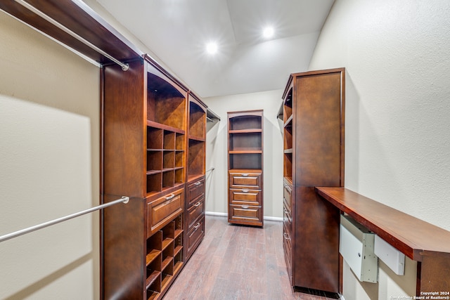 walk in closet featuring light hardwood / wood-style flooring