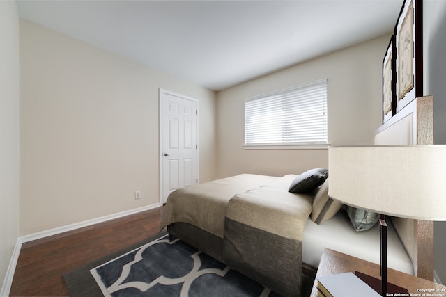 bedroom featuring dark hardwood / wood-style flooring