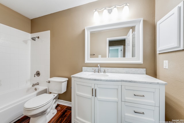 full bathroom featuring toilet, hardwood / wood-style flooring, vanity, and tub / shower combination