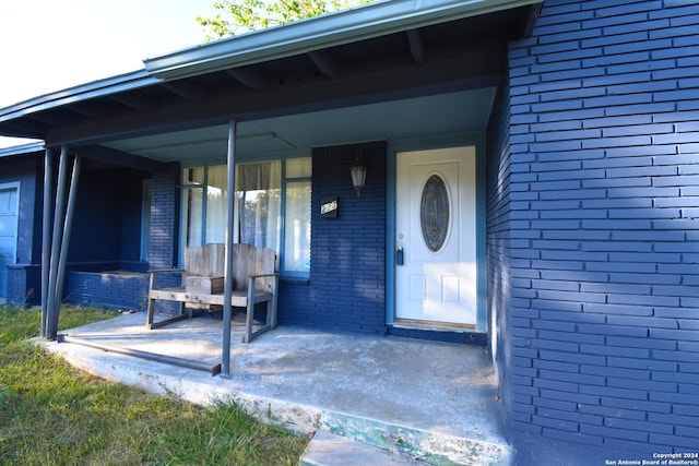 entrance to property with a porch