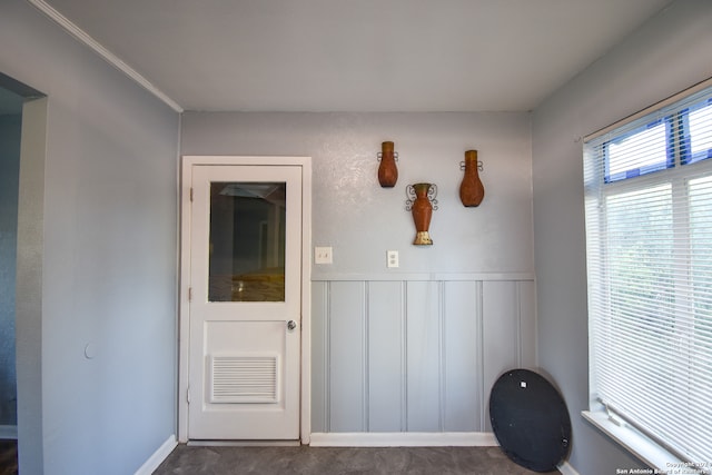 interior space with crown molding