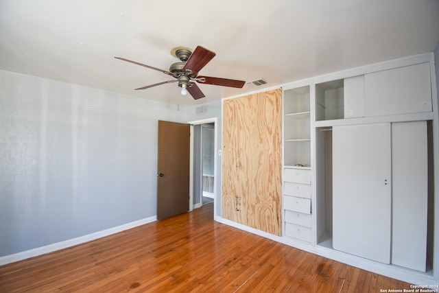 unfurnished bedroom with wood-type flooring and ceiling fan