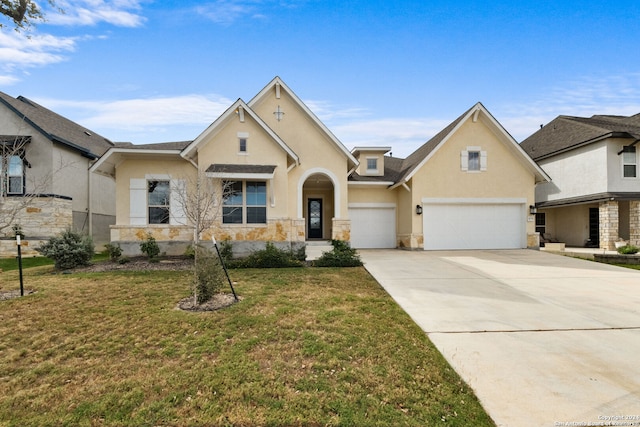 view of front of house with a garage and a front lawn