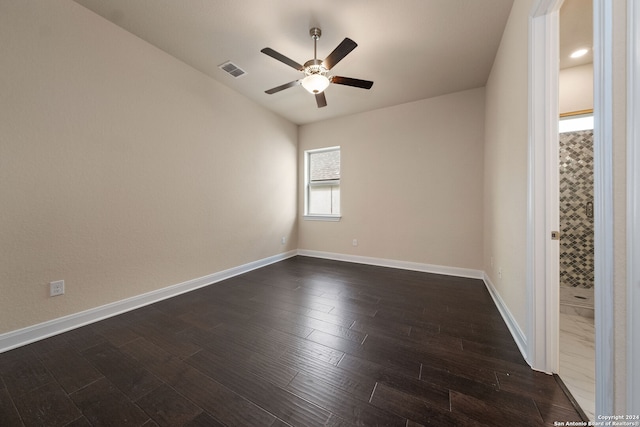 unfurnished room featuring ceiling fan and dark hardwood / wood-style flooring