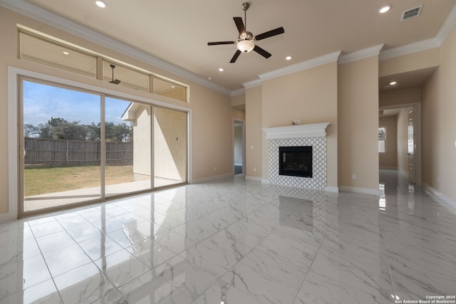 unfurnished living room featuring crown molding, a fireplace, and ceiling fan