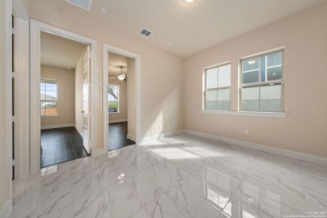 empty room featuring light hardwood / wood-style floors and ceiling fan