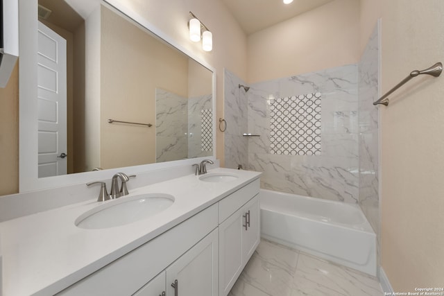 bathroom featuring vanity and tiled shower / bath combo