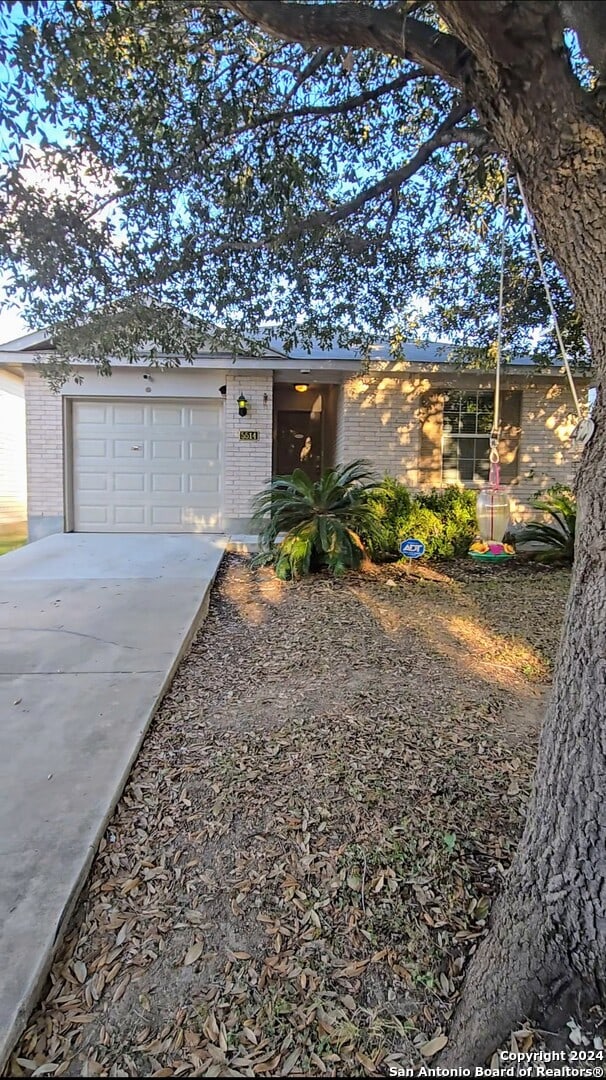 single story home with a garage