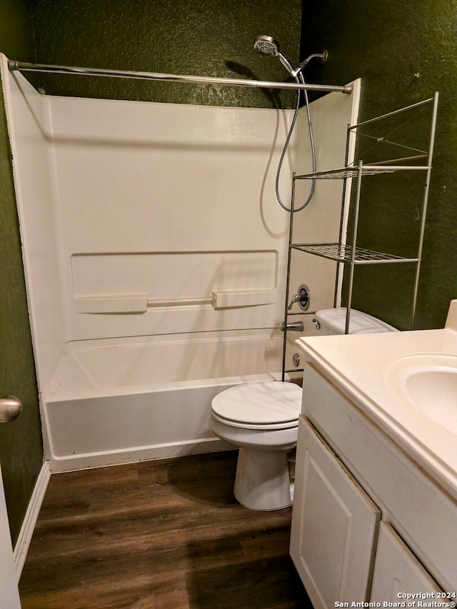 full bathroom with vanity, wood-type flooring, bathtub / shower combination, and toilet