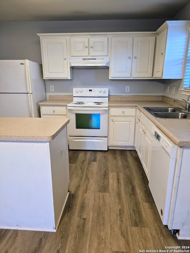 kitchen with white cabinets, white appliances, dark wood-type flooring, and sink