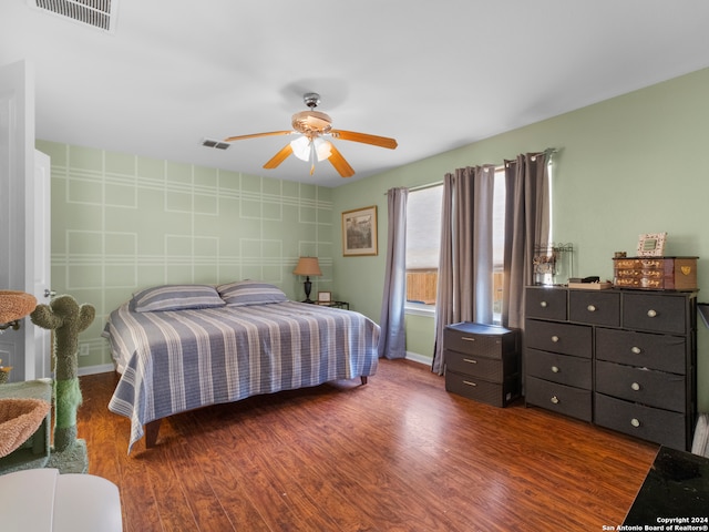 bedroom featuring ceiling fan and dark hardwood / wood-style flooring