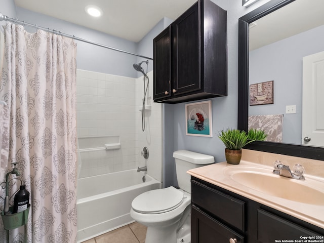 full bathroom featuring vanity, toilet, tile patterned floors, and shower / bathtub combination with curtain