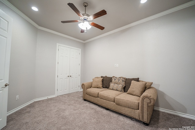 living room with crown molding, carpet floors, and ceiling fan