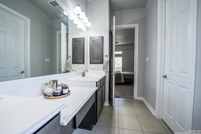 bathroom featuring vanity and tile patterned flooring