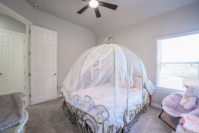 carpeted bedroom featuring vaulted ceiling and ceiling fan