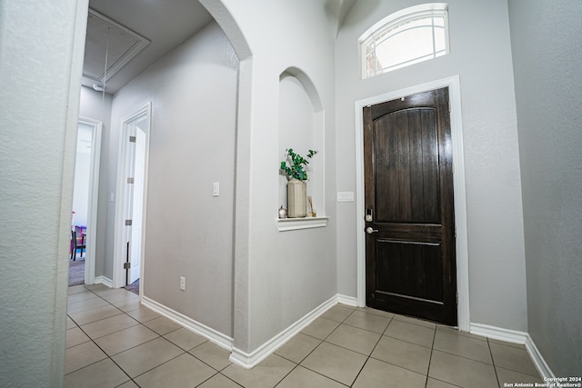 foyer featuring light tile patterned flooring