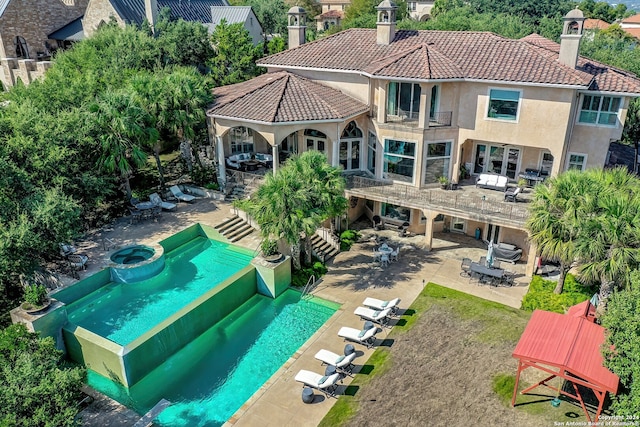 rear view of property featuring a patio area