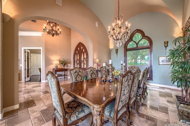 dining space with high vaulted ceiling