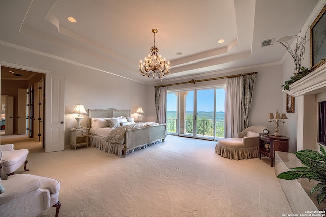 bedroom featuring access to outside, light colored carpet, a tray ceiling, and crown molding