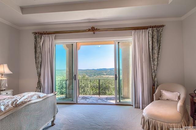 bedroom with a mountain view, light carpet, access to outside, and ornamental molding