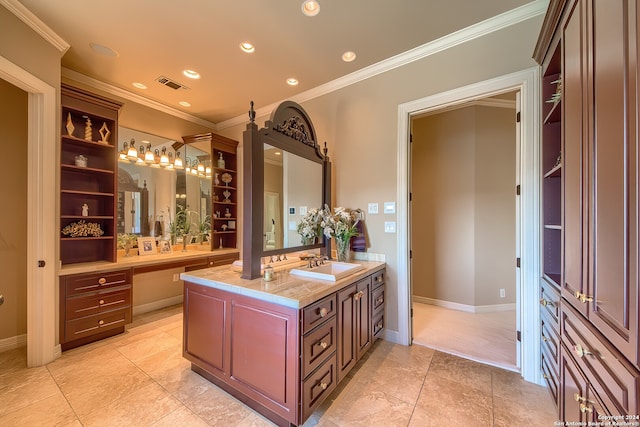 bathroom with vanity, crown molding, and tile patterned floors