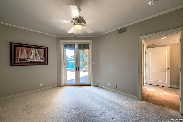 unfurnished room with french doors, ceiling fan, ornamental molding, and light colored carpet