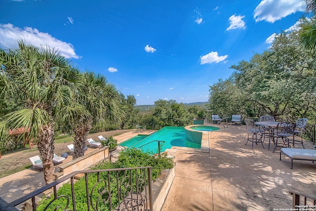 view of pool featuring a patio area