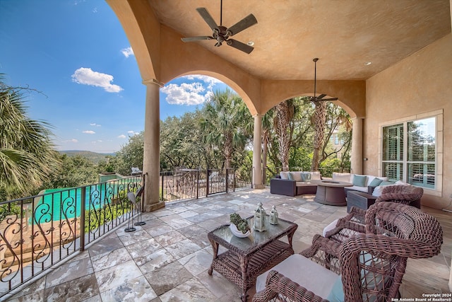 view of patio with outdoor lounge area and ceiling fan