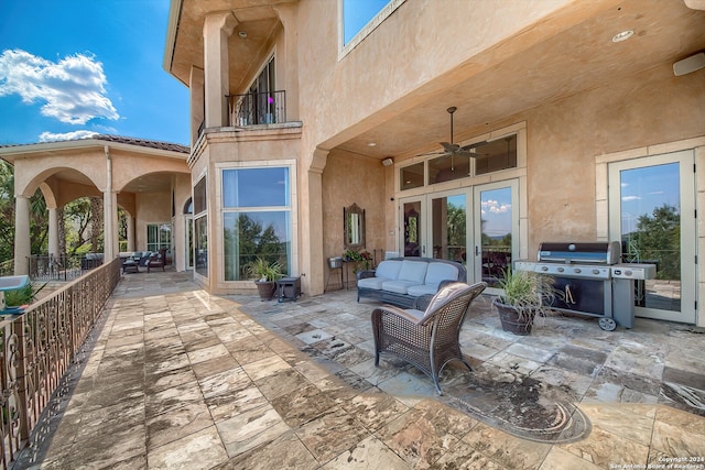 view of patio / terrace featuring a balcony, outdoor lounge area, a grill, and ceiling fan