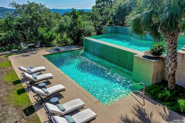 view of pool featuring a patio