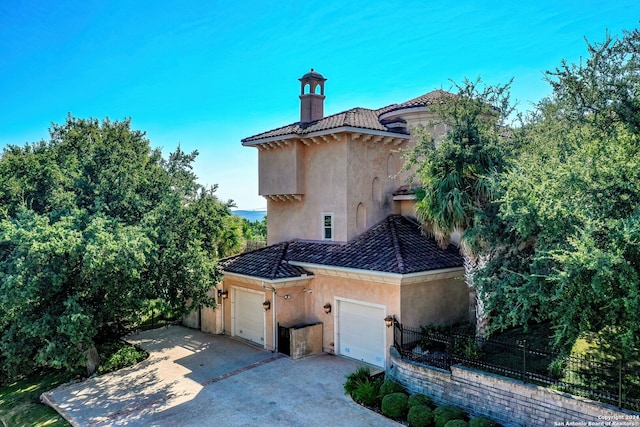 view of side of property featuring a garage