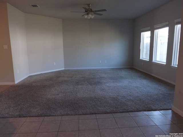 carpeted empty room with ceiling fan