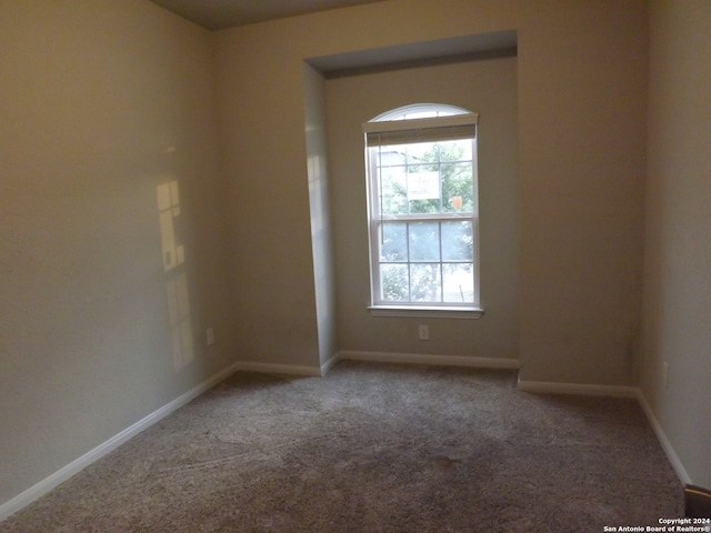 empty room with carpet flooring