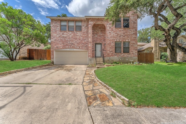 view of front of house featuring a front lawn and a garage