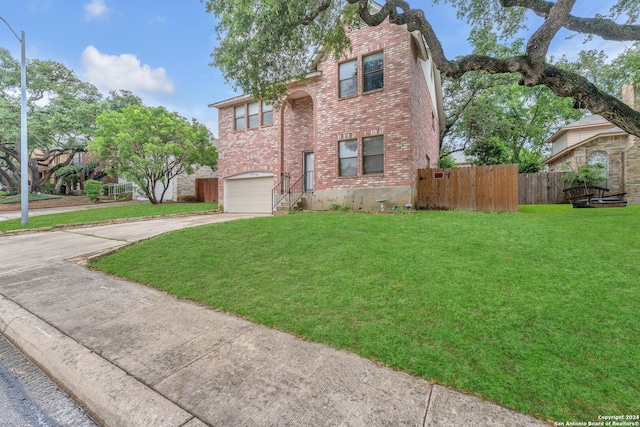 view of front facade with a front lawn and a garage