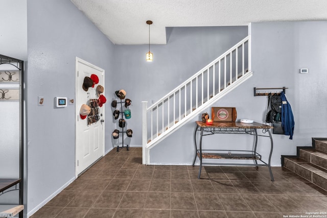 entrance foyer with a textured ceiling