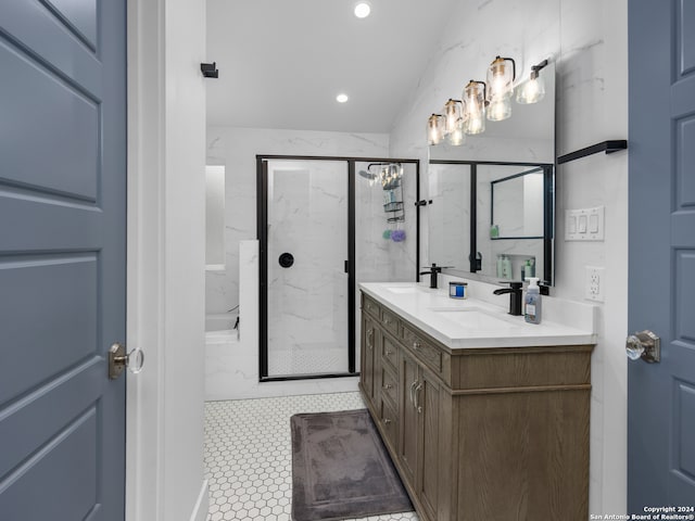 bathroom featuring vanity, tile patterned flooring, and a shower with door