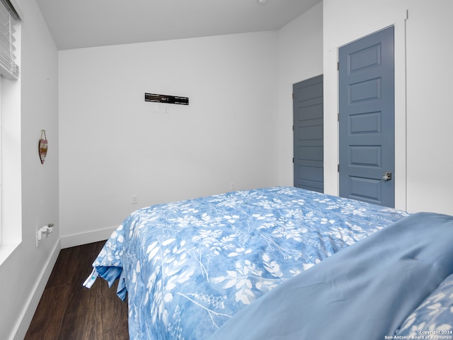 bedroom featuring dark hardwood / wood-style flooring