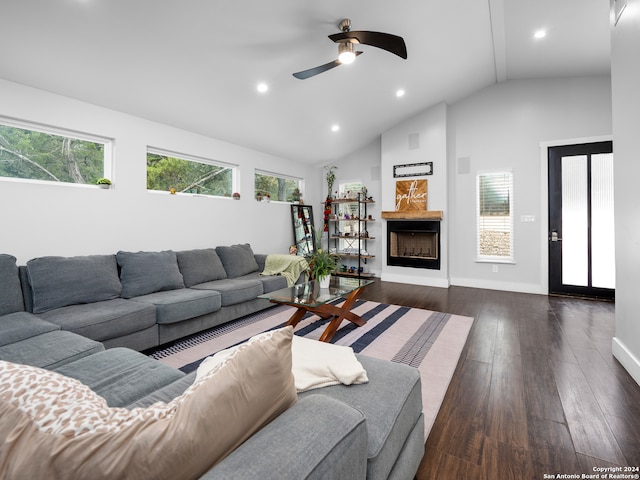 living room with ceiling fan, high vaulted ceiling, and dark hardwood / wood-style flooring