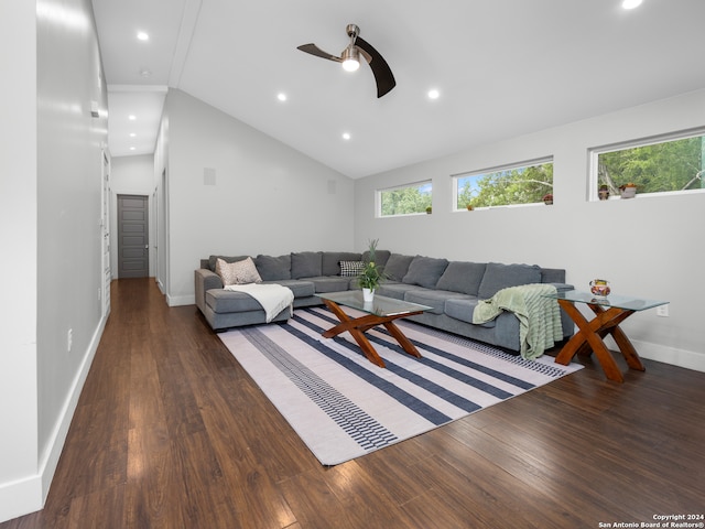 living room with lofted ceiling, dark hardwood / wood-style floors, and ceiling fan