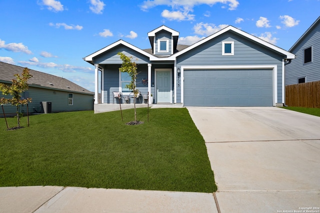 view of front of home featuring a front yard and a garage