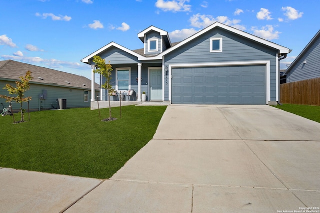 view of front facade featuring a front yard and a garage