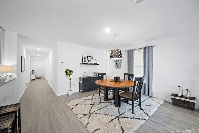 dining space featuring light hardwood / wood-style floors