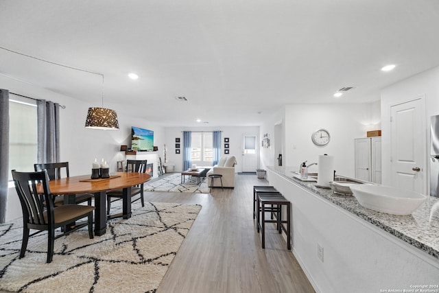 dining space featuring hardwood / wood-style flooring