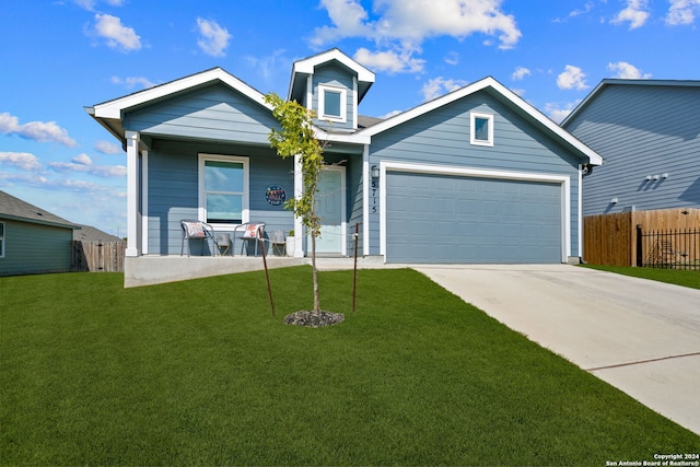 view of front of property with a garage and a front lawn