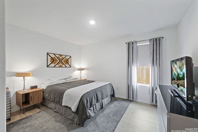 bedroom with light wood-type flooring