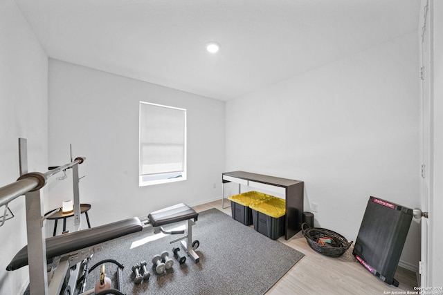 exercise area with light hardwood / wood-style floors