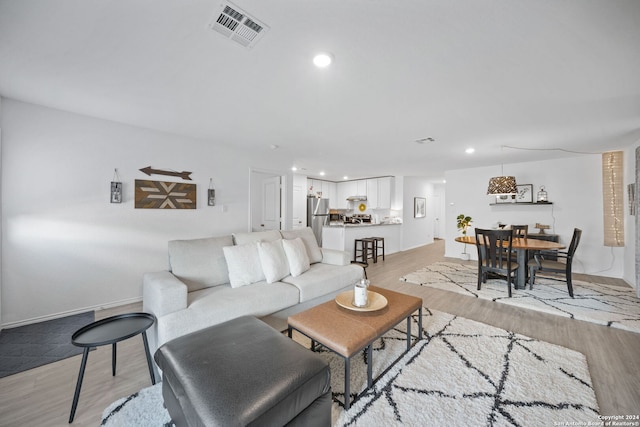 living room featuring light wood-type flooring