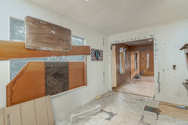 interior space featuring wood walls