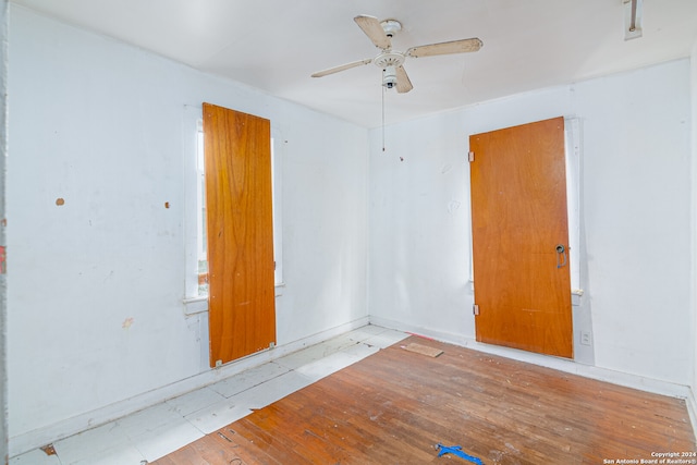 empty room featuring ceiling fan and light wood-type flooring